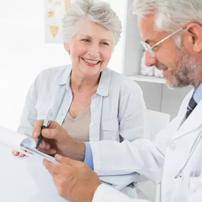 A senior talks with her doctor.