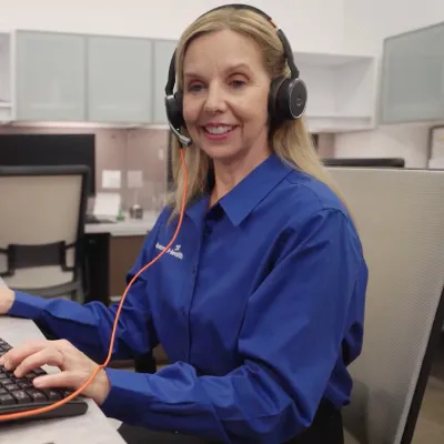 A Care Coordinator Helps a Patient on the Phone