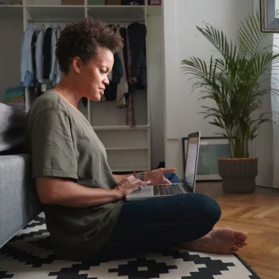 A woman doing research on her computer.