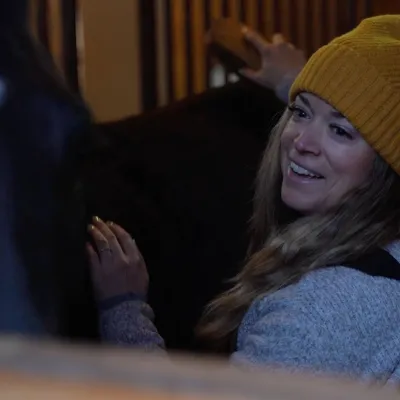 Woman grooming her horse.