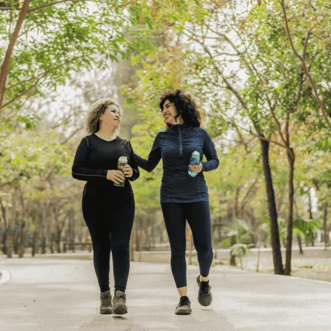 Two woman walking together