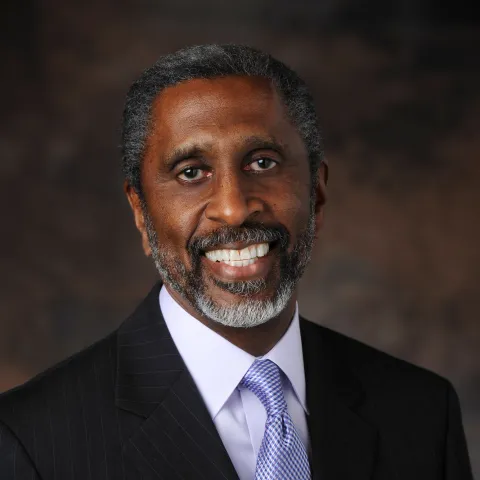 A portrait picture of author Louis Preston