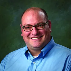 A portrait picture of Dr. Koster