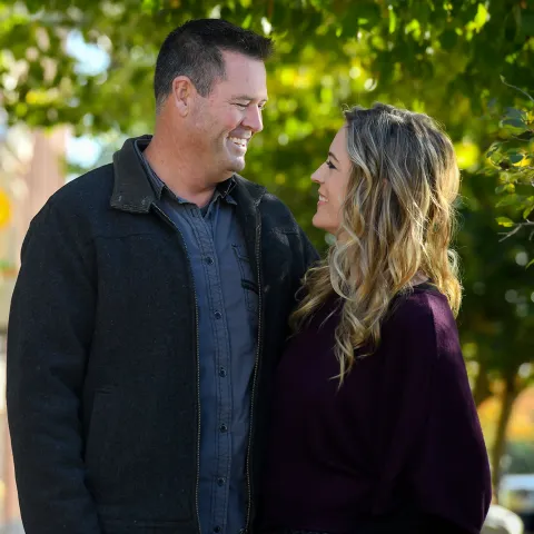 Couple taking a walk down the drive.