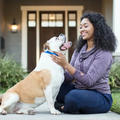 Woman playing with her dog.