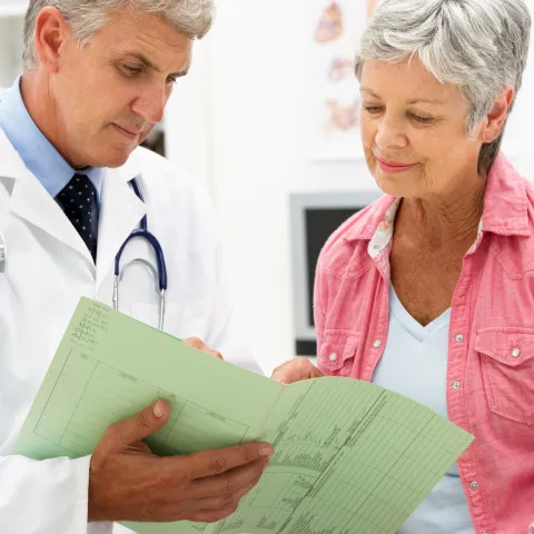 Woman reviewing her imaging test with her doctor