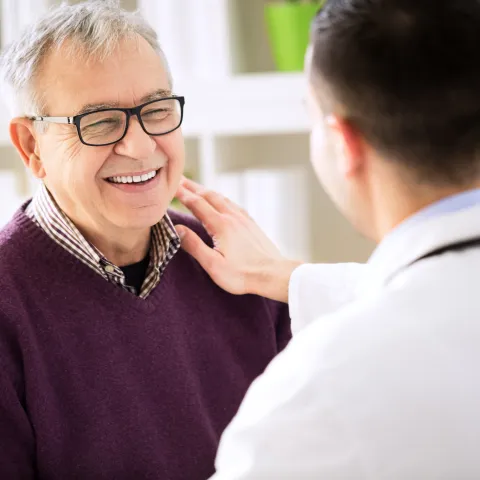 Smiling man visits doctor