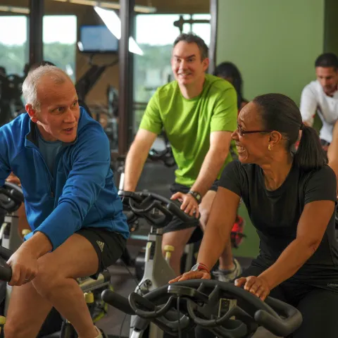 Adults, young and old, doing a cycling session