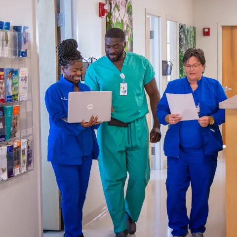AdventHealth Digestive Health Institute Tampa team members walking down a hallway.