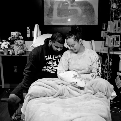 Chelsea Hubler with her partner and newborn child