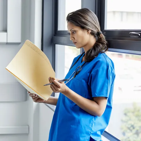 A doctor reads the results of a study.