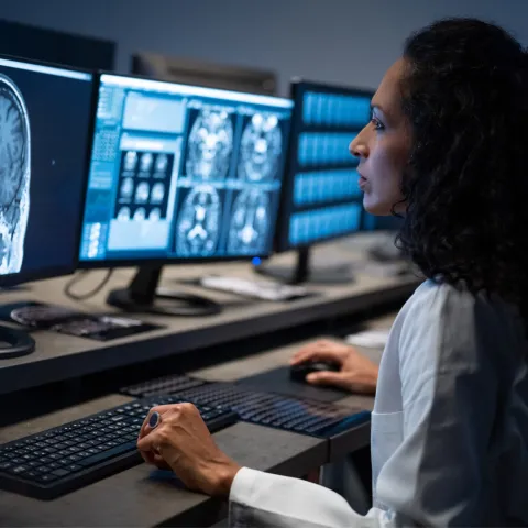 Doctor looking at a brain CT scan.