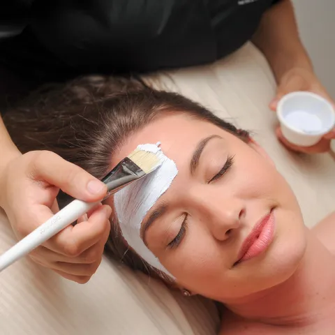 Woman getting a facial at the spa