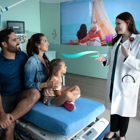 A Doctor Speaks to a Family at AdventHealth ER at FLAMINGO CROSSINGS Town Center