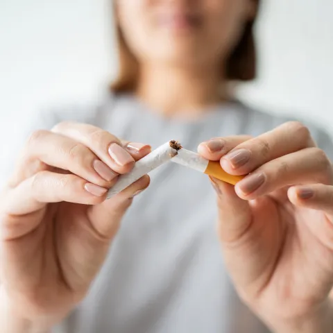 freedom-from-smoking-woman-breaking-cigarette