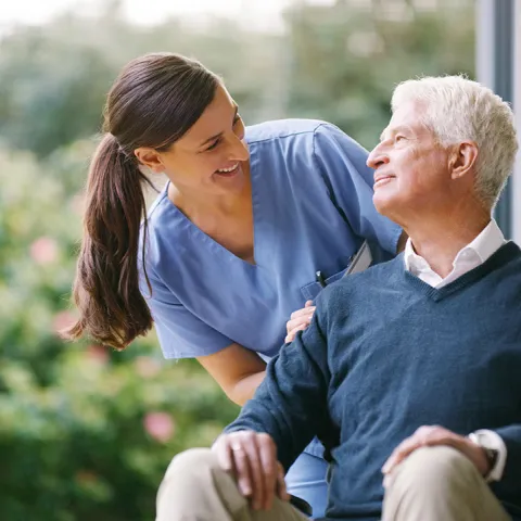 Patient in wheelchair with caregiver