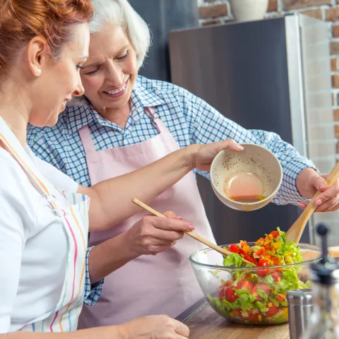 Two women cooking together