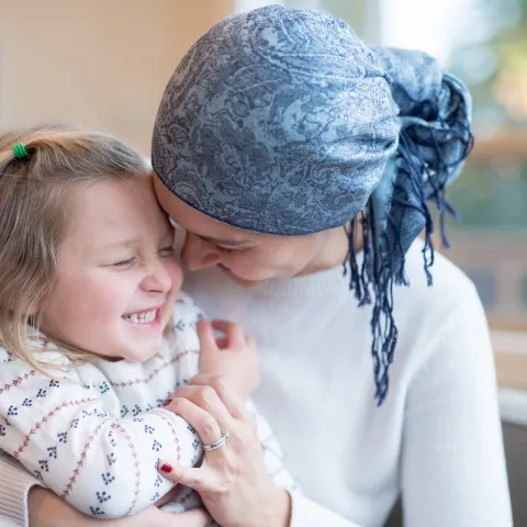 Woman hugging a girl
