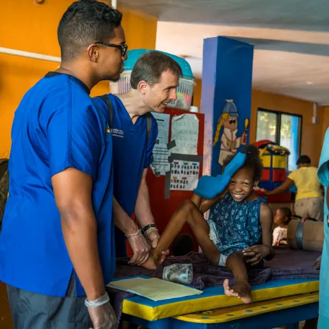 Physicians caring for a small girl
