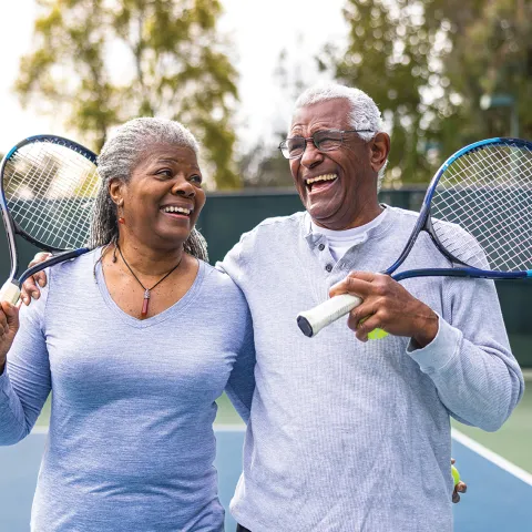 A couple playing tennis