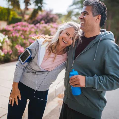 A couple takes a break during a workout.