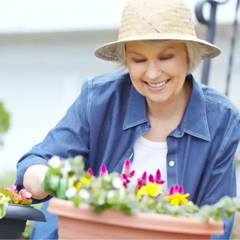 A woman gardening at home.