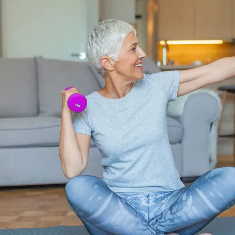A woman exercising at home.