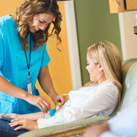 A patient gets her blood drawn.