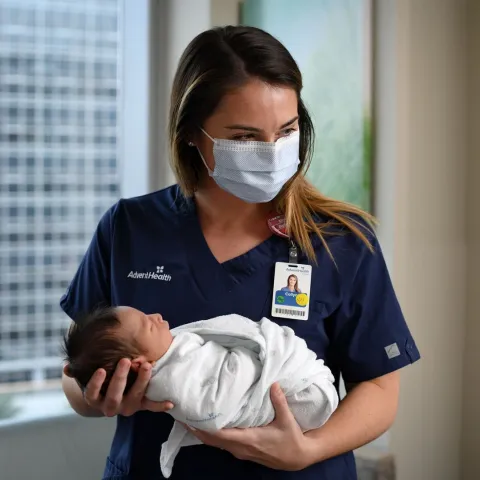 Nurse holding baby