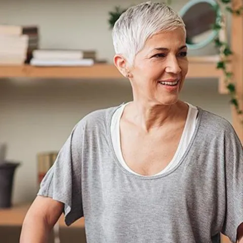 woman-standing-and-smiling-indoors