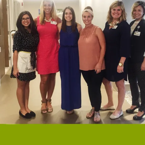 A group of women posing for a photo.