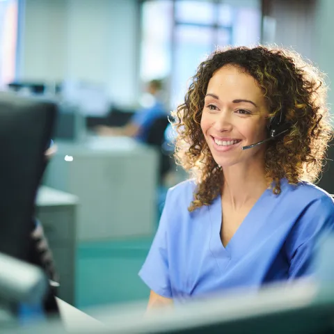 A nurse answering a phone call
