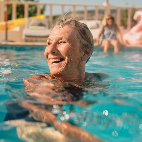 Mature woman swimming in pool