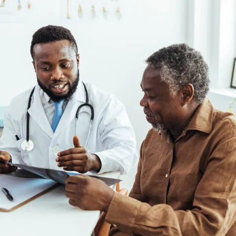 Older man talking to his doctor