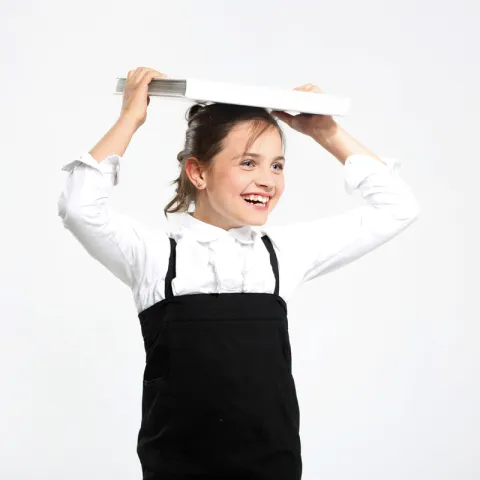 Girl balancing a book on her head