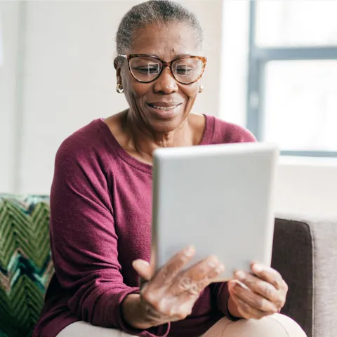 Woman reading tablet