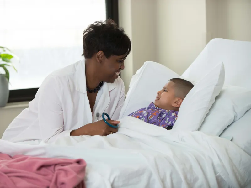 Doctor checking on Child.