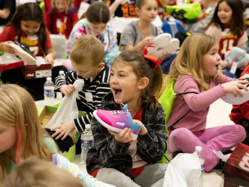 Little girls with a new pair of shoes.