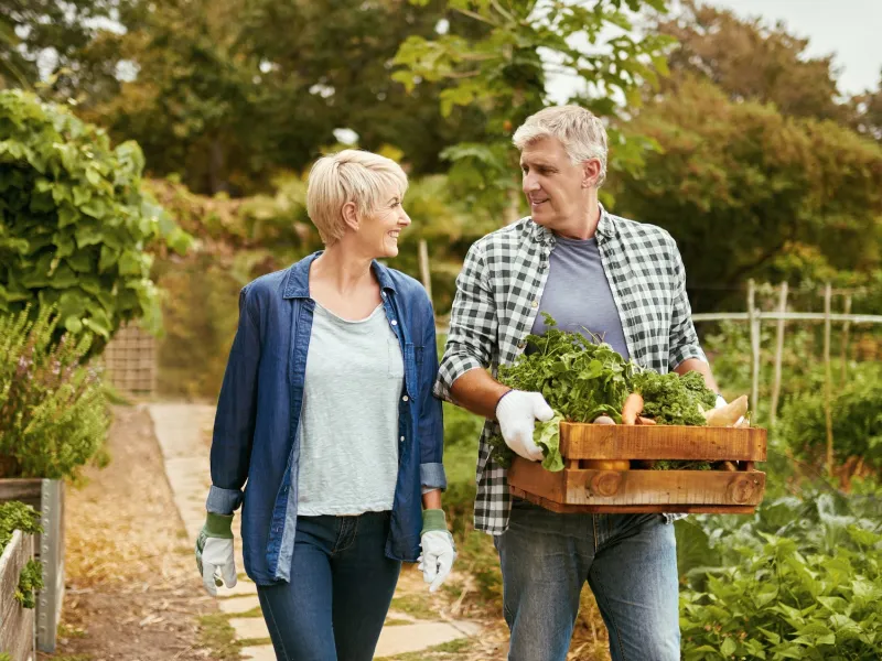 man and woman walking outdoors
