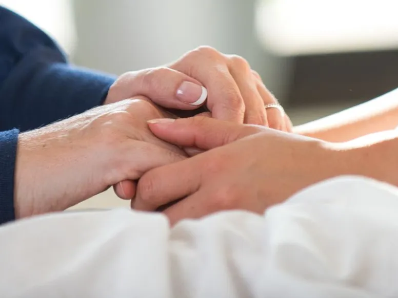 two people holding hands.