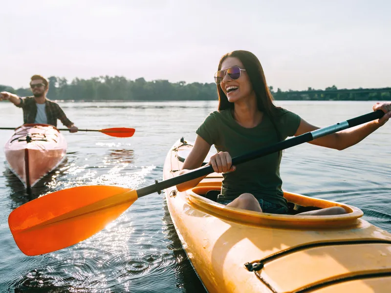 Happy Couple Kayaking on a lake