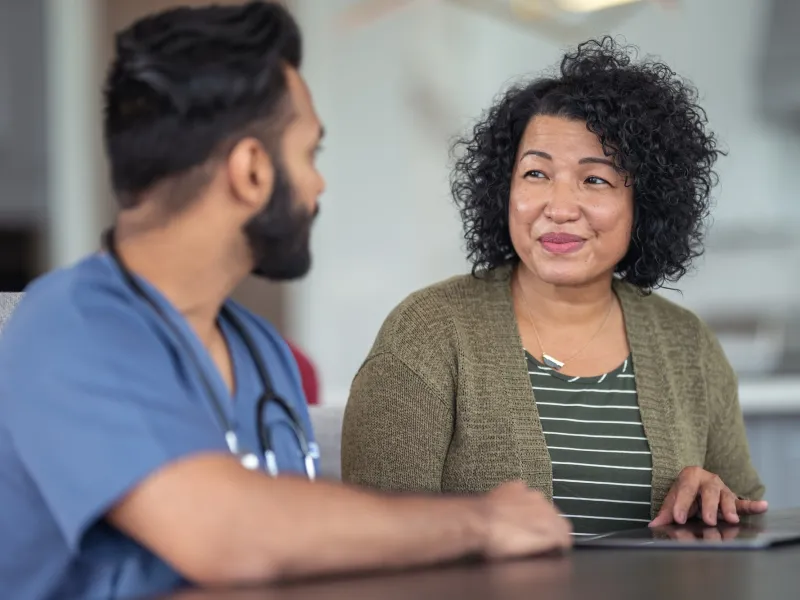 A woman meets with her doctor.