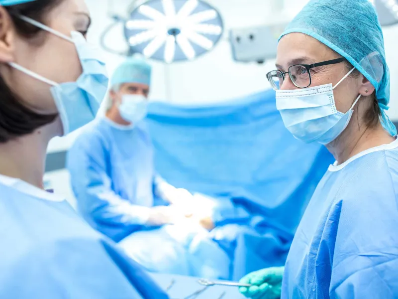 A surgical team talking while doing surgery