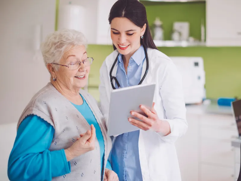 Senior patient reviewing a chart with her doctor