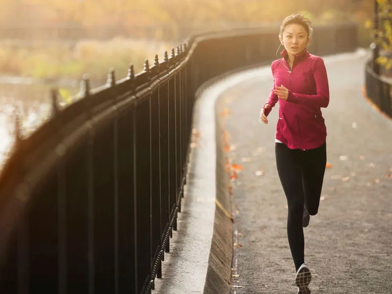 Woman Running on pathway