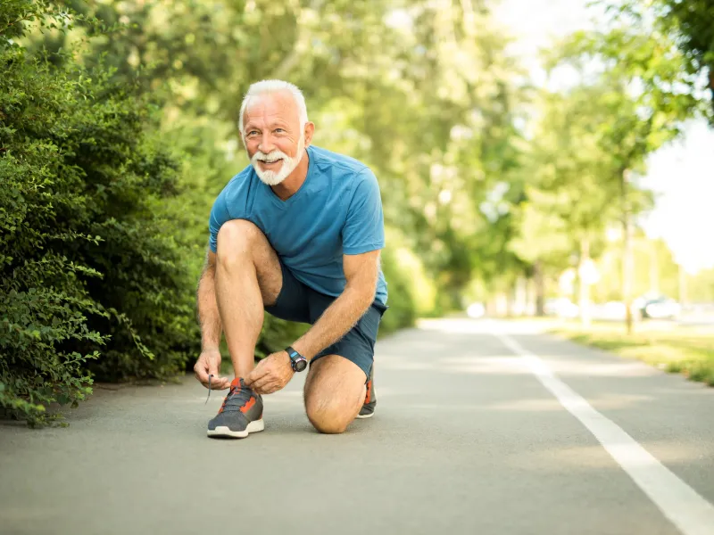 Senior Tying Running Shoes