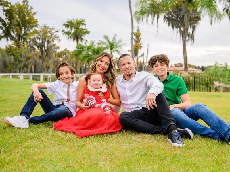 The Tremonti family posing for a photo outdoors