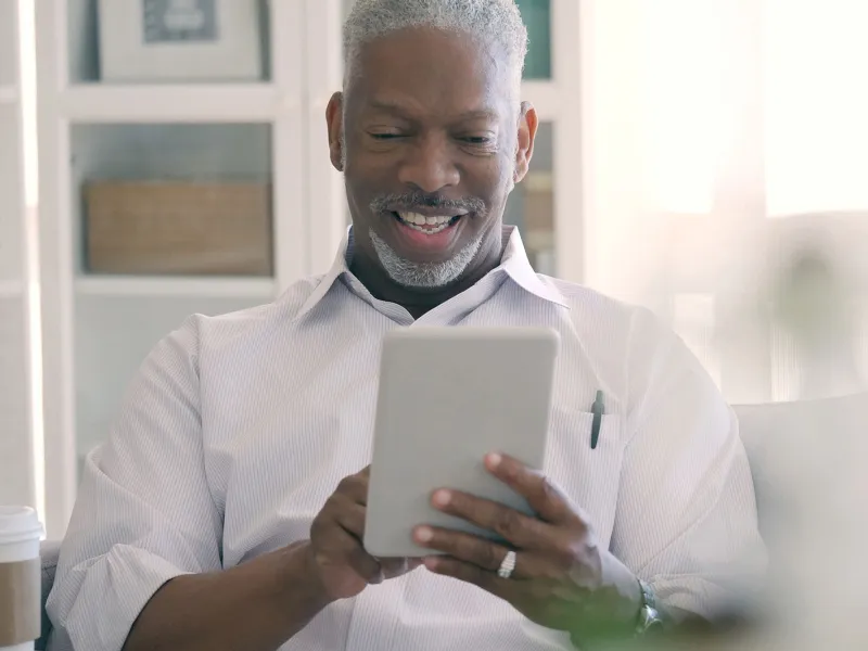 Man on a video call with his physician.