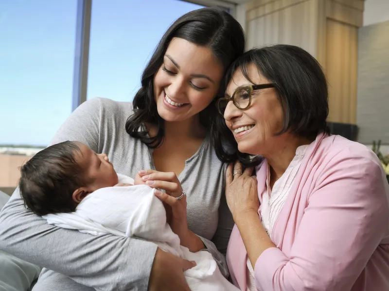 Mother and Grandmother holding a baby