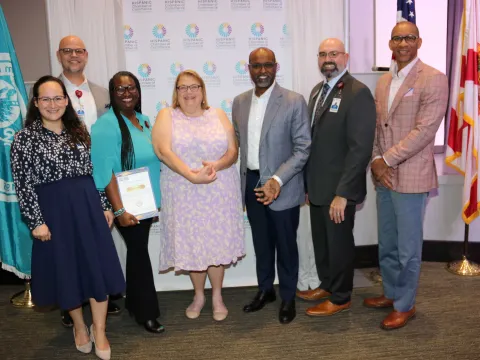 Abel Biri and Holly Soucy joined by other AdventHealth team members during the recent Hispanic Chamber of Commerce Healthcare Awards. 